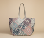 Close-up of Ahir embroidery floral stitching detail on ivory tote