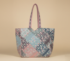 Model carrying Ahir embroidery pink tote bag — boho style