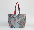 Model carrying Ahir embroidery red tote bag — boho style