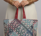 Model walking with Ahir embroidery red tote bag — lifestyle shot