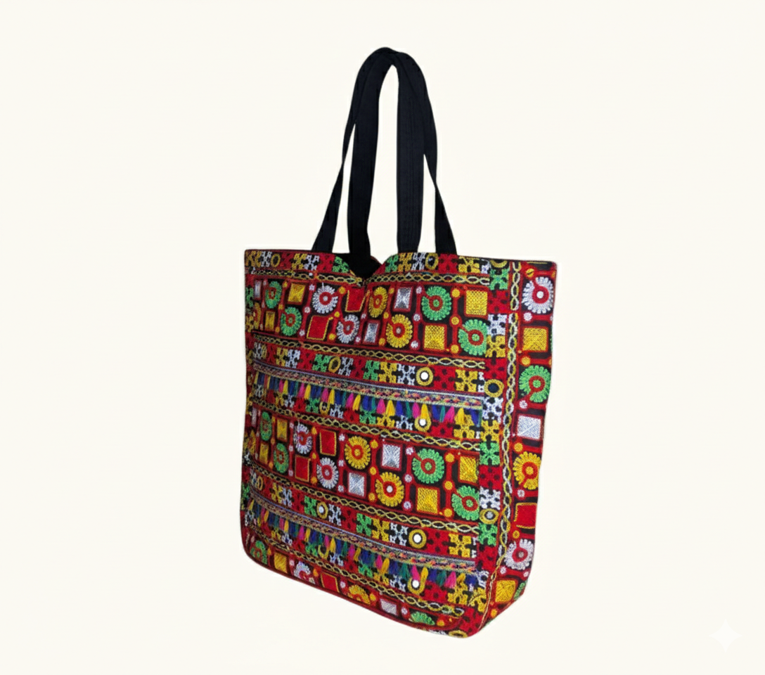 Model carrying Jat Mutava red geometric Suf tote bag — boho style