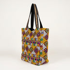 Model carrying Jat Mutava yellow white diamond Suf tote bag — boho style