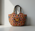 Model walking with Rabari embroidery black elephant tote bag — lifestyle shot
