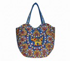 Model walking with Rabari embroidery blue elephant tote bag — lifestyle shot