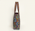 Model carrying Rabari embroidery maroon elephant tote bag — boho style