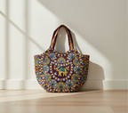Model walking with Rabari embroidery maroon elephant tote bag — lifestyle shot