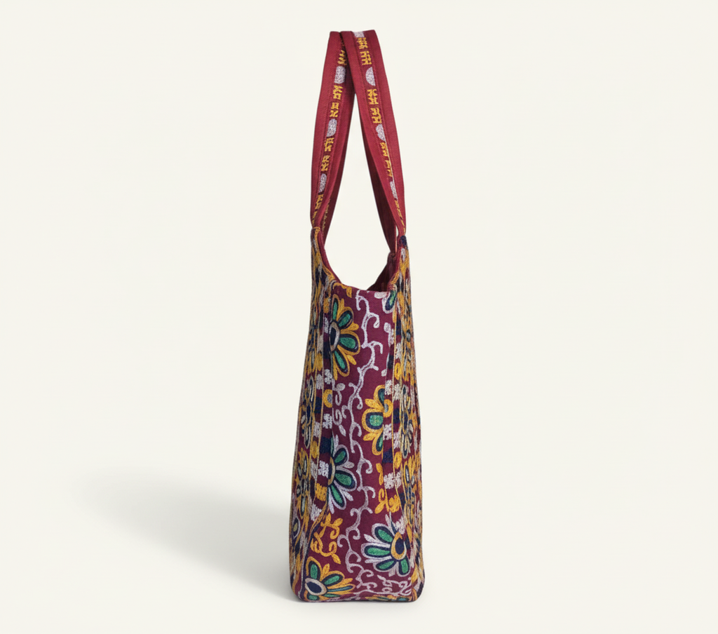 Model walking with Rabari embroidery red elephant tote bag — lifestyle shot