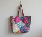Model carrying Applique Patchwork Sandstone Indigo tote bag — boho style