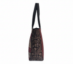 Close-up of Noir Shimmer gotta patchwork metallic detail on tote bag