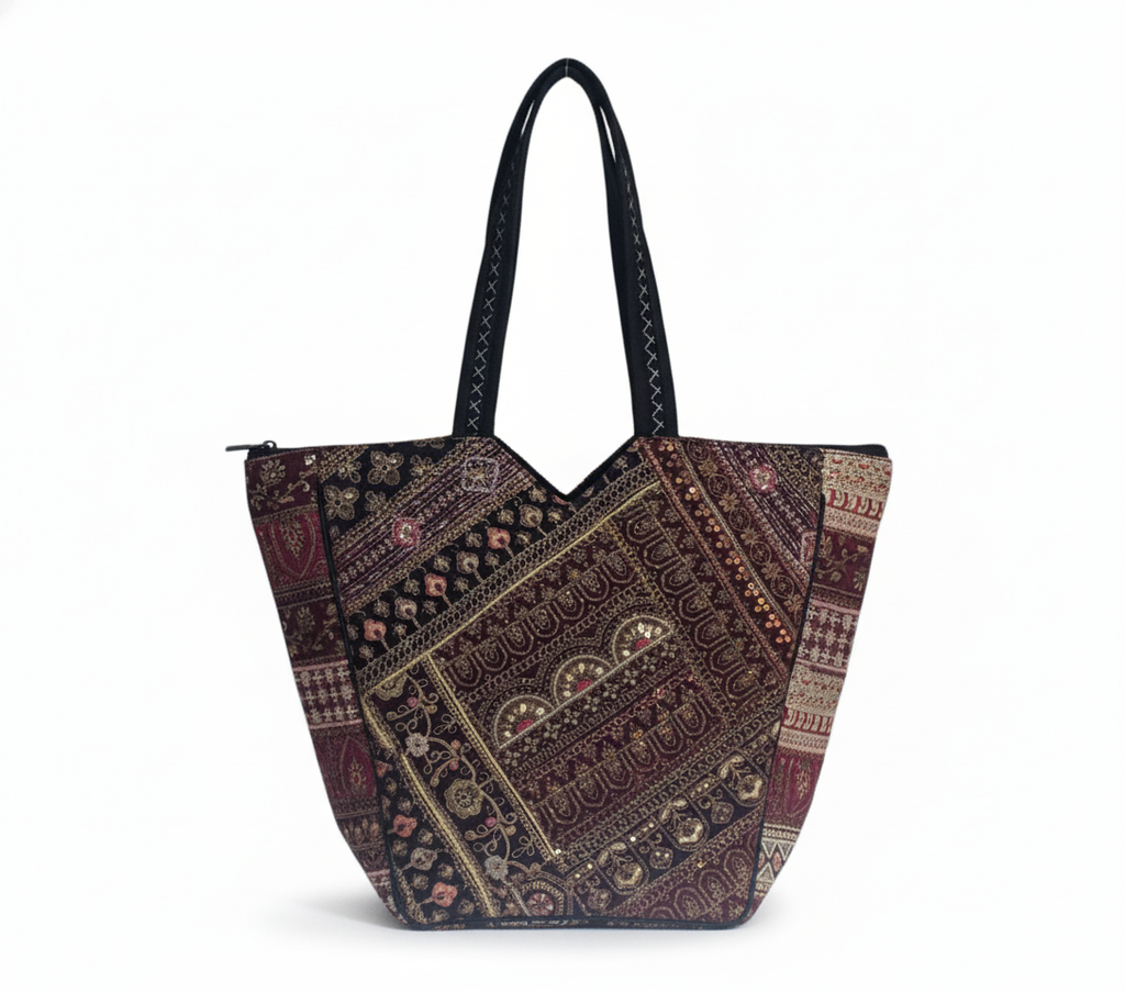 Model carrying Gotta Patch Noir Shimmer tote bag — boho style