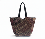 Model carrying Gotta Patch Noir Shimmer tote bag — boho style