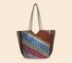 Close-up of Ivory Gleam gotta patti mirror and tassel detail on tote bag