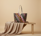 Model carrying Gotta Patti Mirror Tassel Ivory Gleam tote bag — boho style
