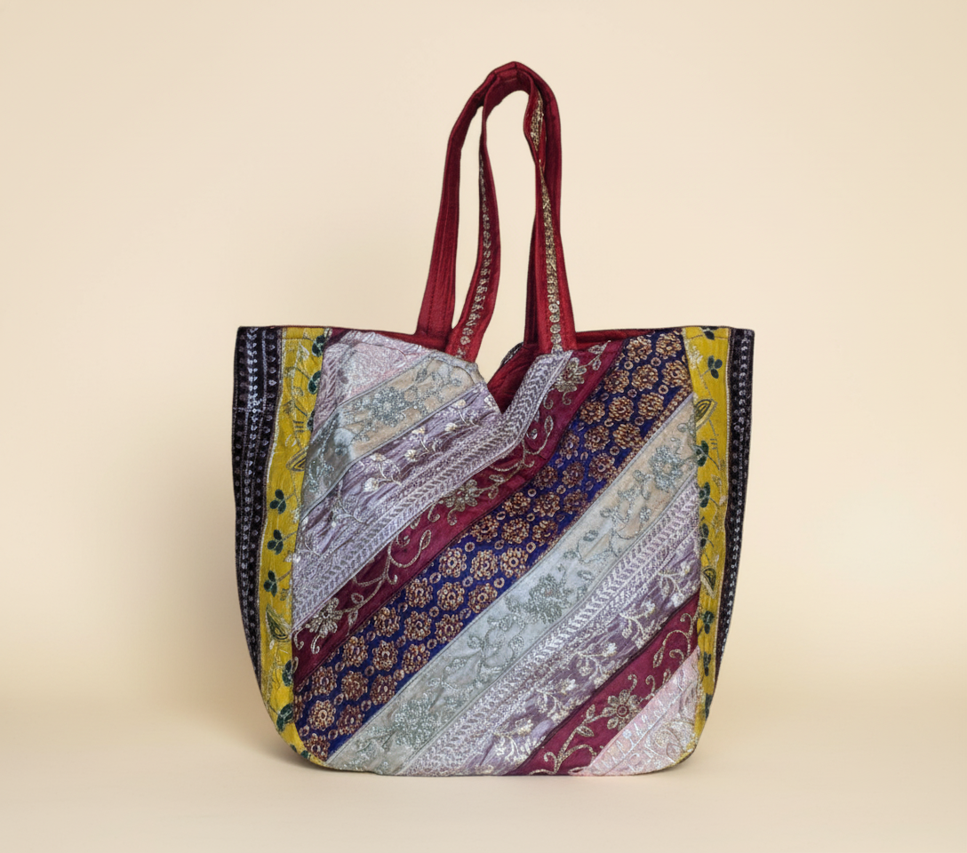 Close-up of Scarlet Gleam gotta patti mirror and tassel detail on tote bag