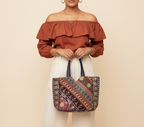 Model walking with Gotta Patti No Tassel Sapphire Elegance tote bag — lifestyle shot