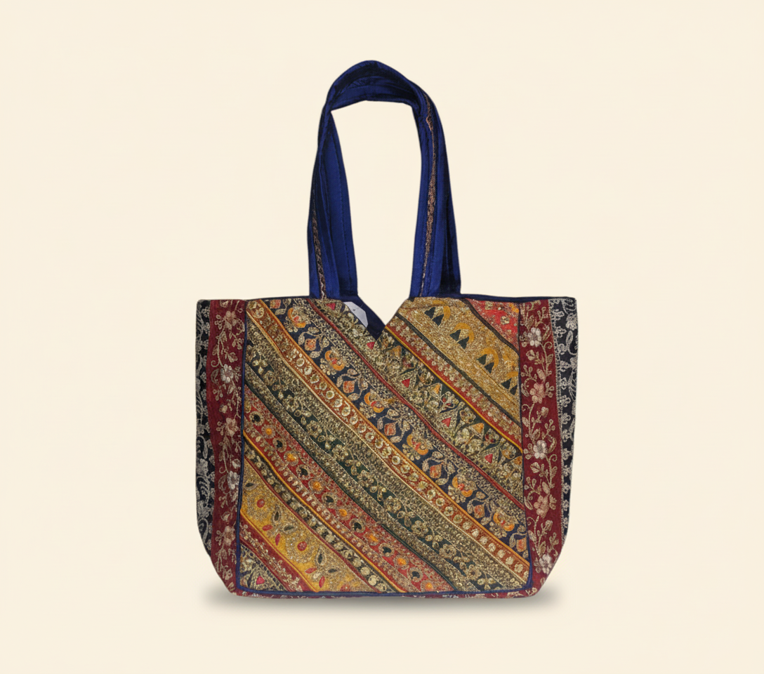 Model carrying Gotta Patti No Tassel Cobalt Elegance tote bag — boho style