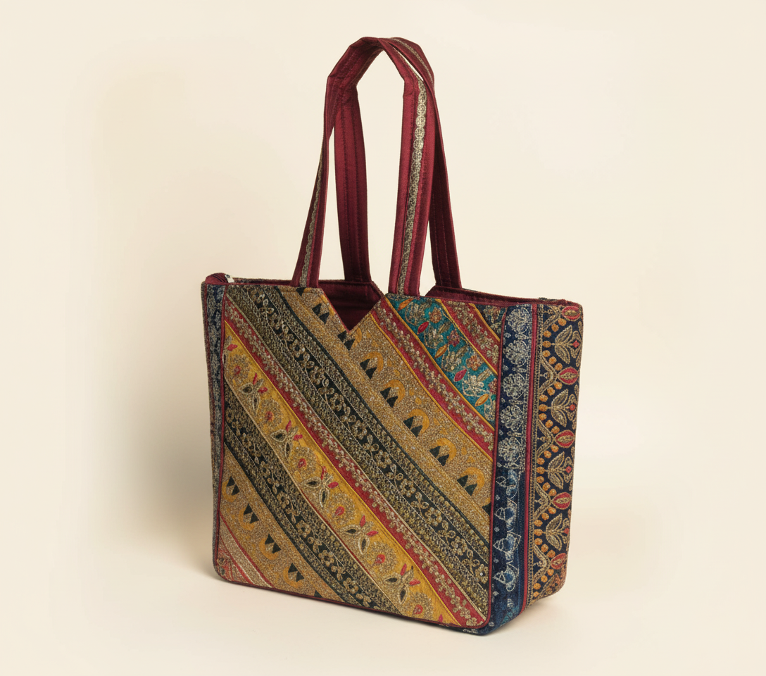 Close-up of Burgundy Elegance gotta patti ribbon detail on tote bag