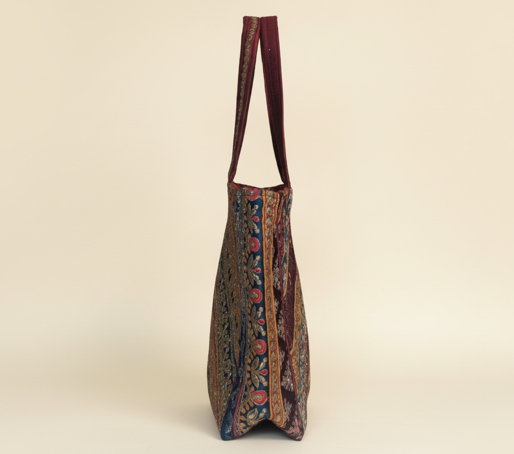 Model carrying Gotta Patti No Tassel Burgundy Elegance tote bag — boho style