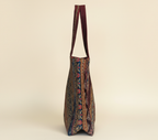 Model carrying Gotta Patti No Tassel Burgundy Elegance tote bag — boho style