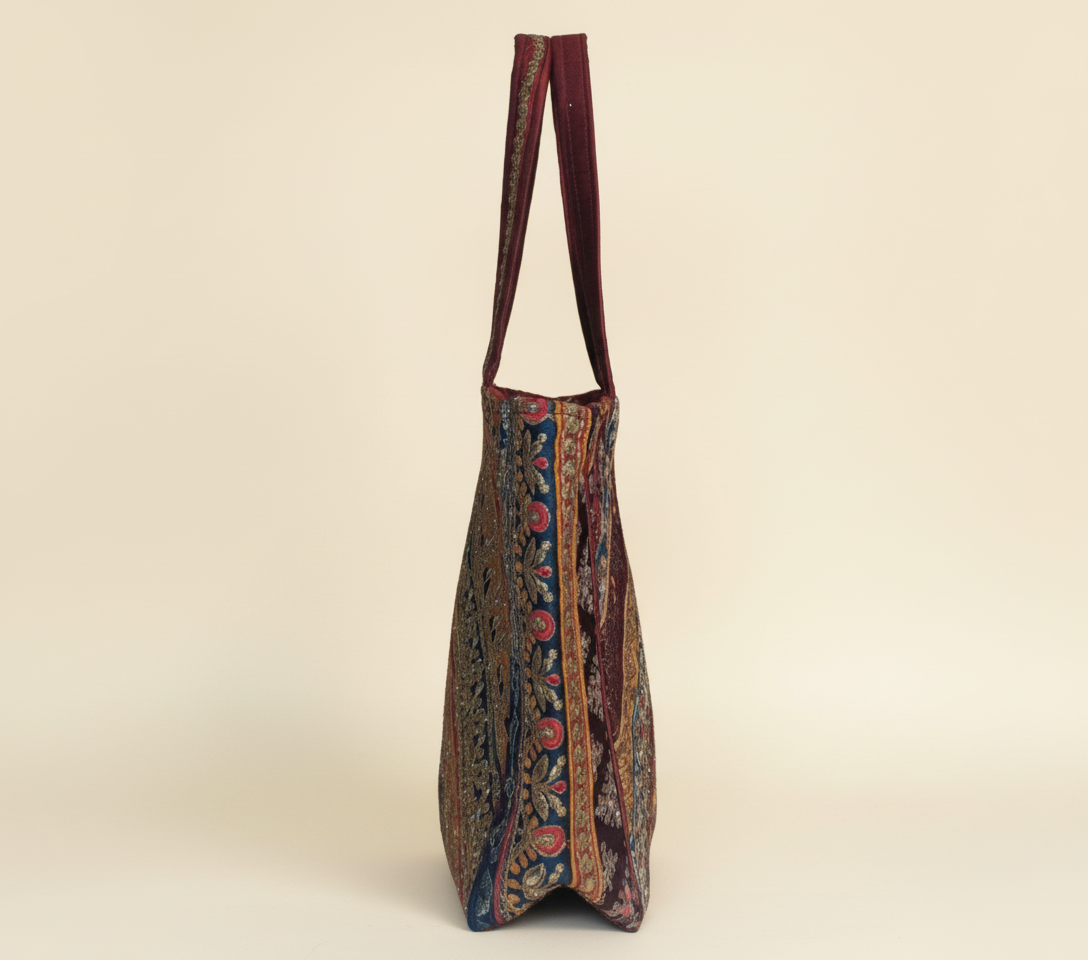 Model carrying Gotta Patti No Tassel Burgundy Elegance tote bag — boho style