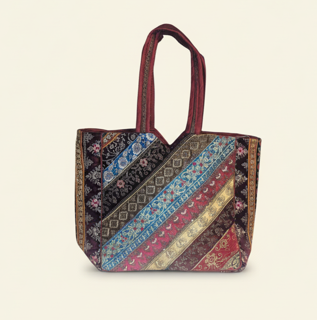 Model walking with Gotta Patti No Tassel Burgundy Elegance tote bag — lifestyle shot