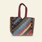 Model walking with Gotta Patti No Tassel Burgundy Elegance tote bag — lifestyle shot