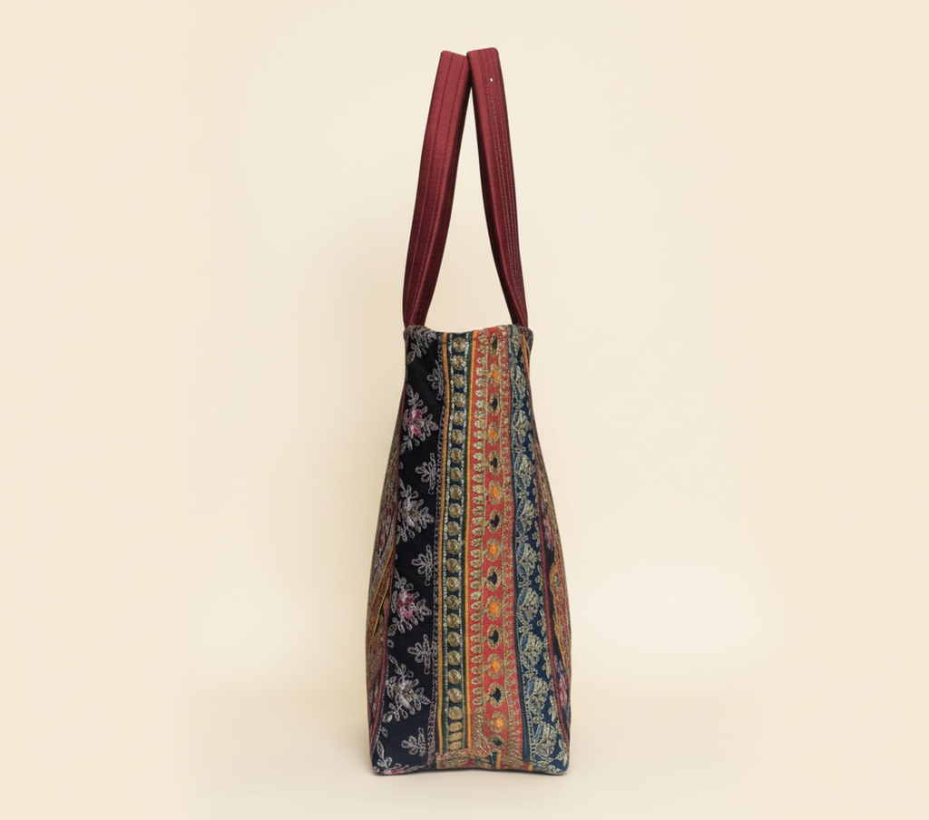Close-up of Wine Elegance gotta patti ribbon detail on tote bag