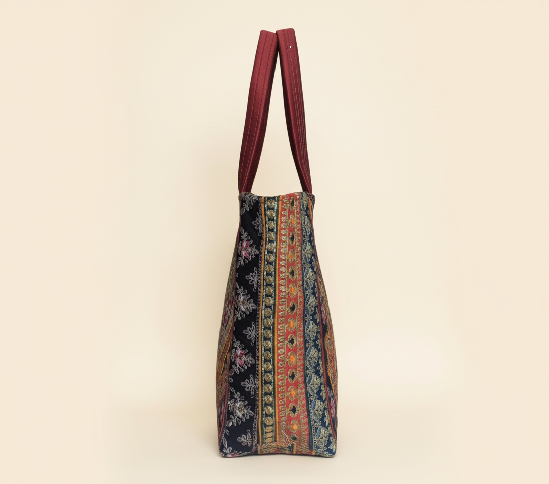Close-up of Wine Elegance gotta patti ribbon detail on tote bag