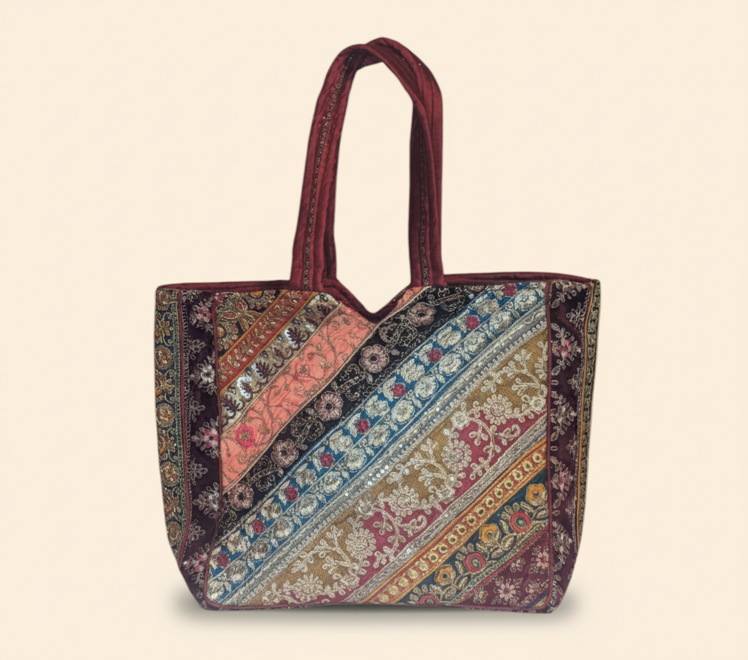 Model carrying Gotta Patti No Tassel Wine Elegance tote bag — boho style