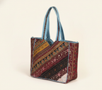 Model carrying Gotta Patti No Tassel Azure Elegance tote bag — boho style