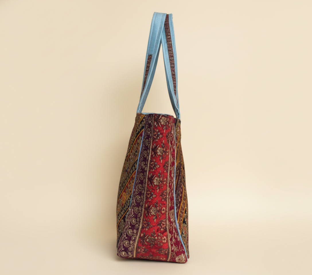 Model walking with Gotta Patti No Tassel Azure Elegance tote bag — lifestyle shot