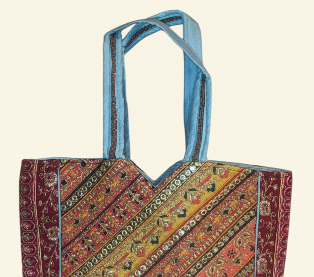 Close-up of Sunrise Elegance gotta patti ribbon detail on tote bag