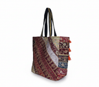 Model carrying Gotta Patti Shell Tassel Ember Festival tote bag — boho style