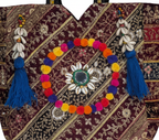 Close-up of Turquoise Festival gotta patti ribbon and shell tassel detail