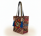 Model carrying Gotta Patti Shell Tassel Turquoise Festival tote bag — boho style