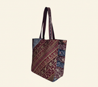 Model carrying Gotta Patti Shell Tassel Celestial Festival tote bag — boho style