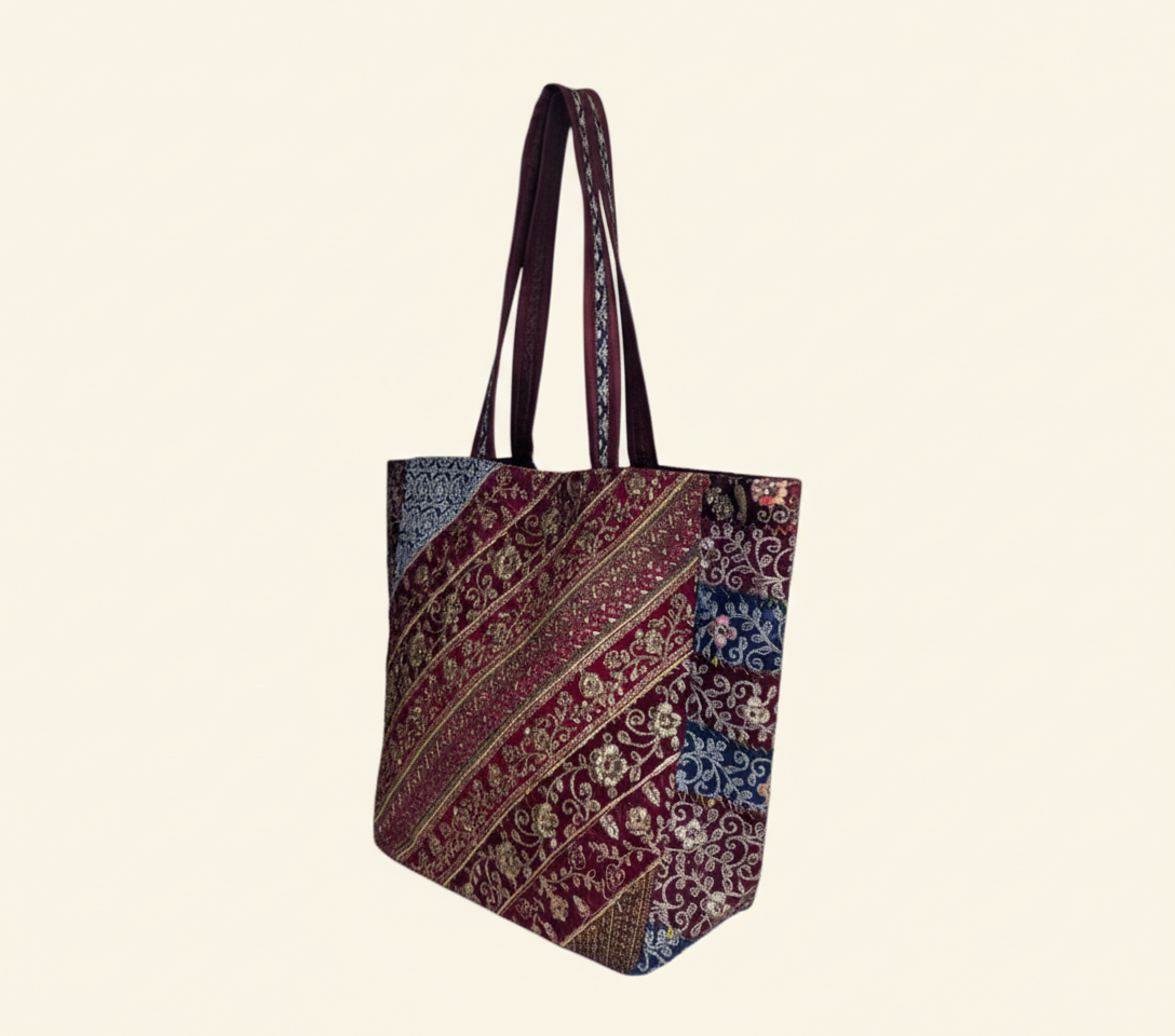 Model carrying Gotta Patti Shell Tassel Celestial Festival tote bag — boho style