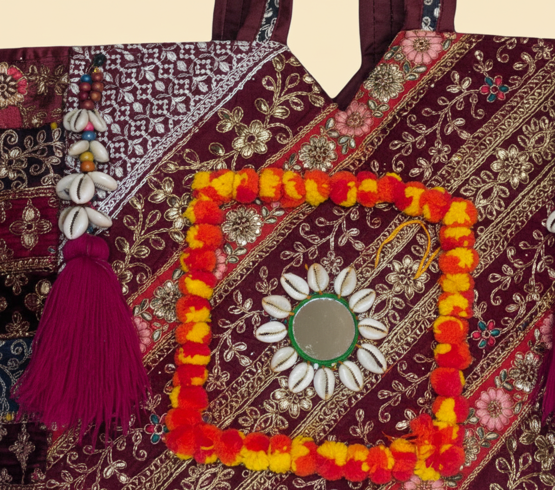 Close-up of Wine Festival gotta patti ribbon and shell tassel detail