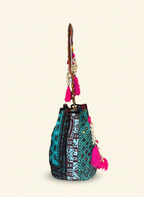 Close-up of Lagoon Bloom cowrie shell & tassel detail