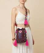 Model carrying Shell Tassel Indigo Dahlia (Medium) bucket bag — boho style