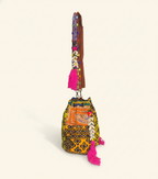 Close-up of Citrus Bloom cowrie shell & tassel detail