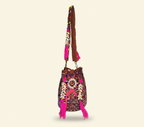 Model carrying Shell Tassel Garnet Arch (Medium) bucket bag — boho style