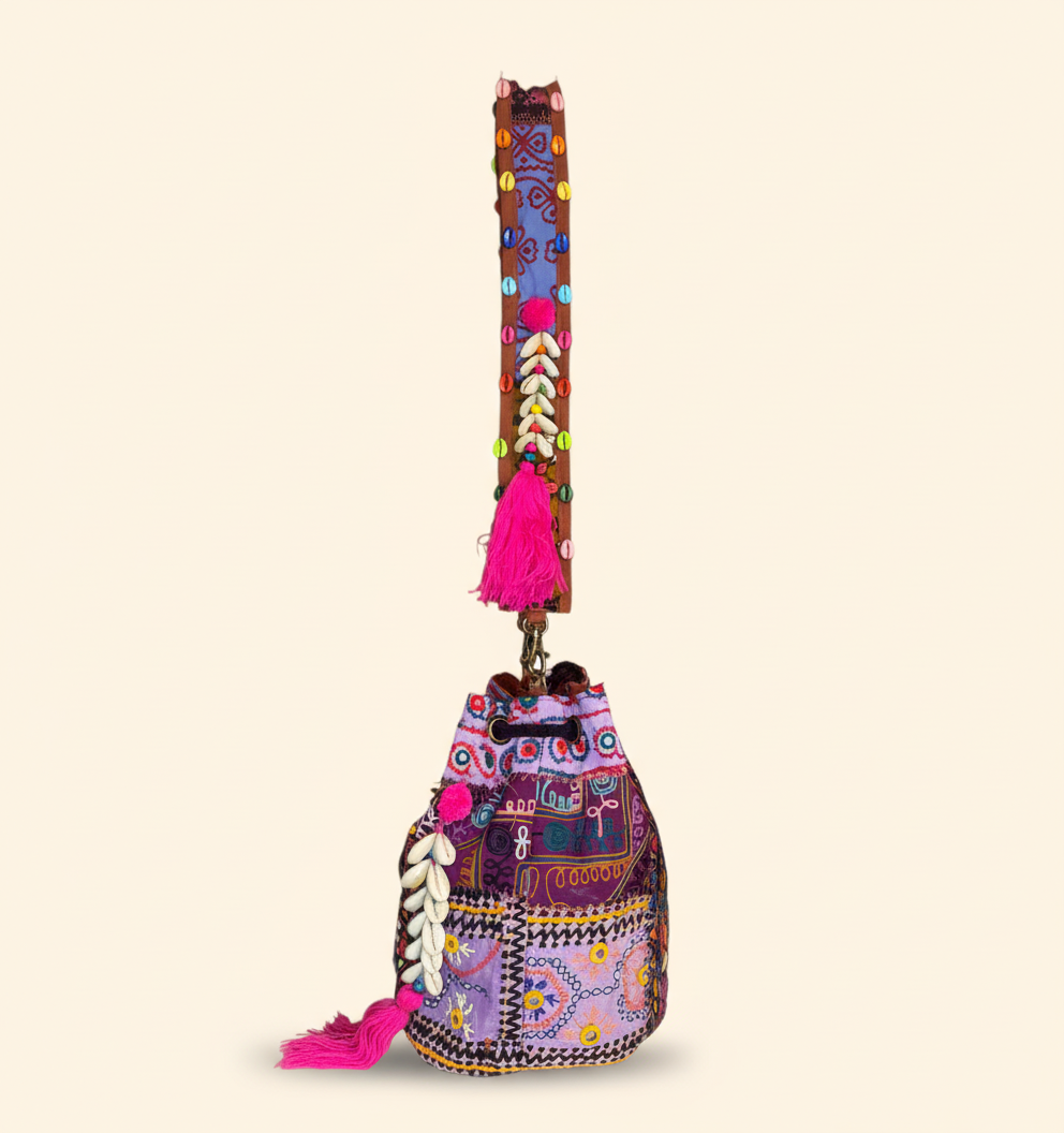 Close-up of Lilac Prism cowrie shell & tassel detail