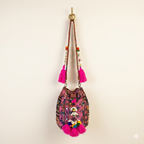 Shell Tassel Fuchsia Spark (Mini) bucket bag side view showing depth