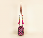 Model carrying Shell Tassel Fuchsia Spark (Mini) bucket bag — boho style