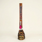 Model carrying Shell Tassel Amber Heirloom (Mini) bucket bag — boho style