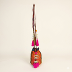 Shell Tassel Tangerine Spark (Mini) bucket bag side view showing depth
