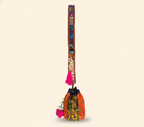 Model carrying Shell Tassel Tangerine Spark (Mini) bucket bag — boho style