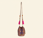 Close-up of Violet Aura cowrie shell & tassel detail