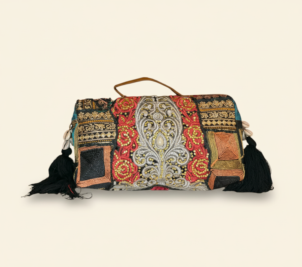 Model carrying Shell Tassel Ratrani crossbody bag — boho style